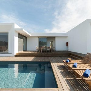 lounge-chairs-in-modern-villa-pool.jpg